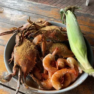 a bowl of seafood and corn