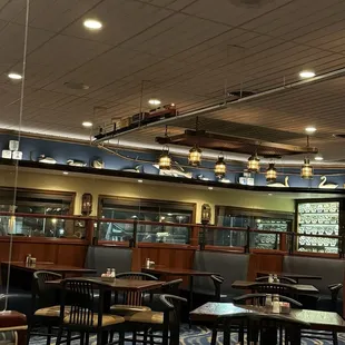 Model train circling the interior of the dining area!