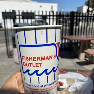 a person holding a cup of coffee