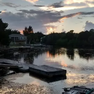 a boat in the water at sunset