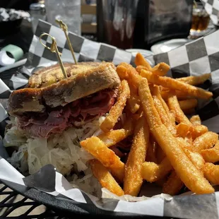 Corned beef Reuben in marble rye bread and their DELICIOUS fries!!! YUM!