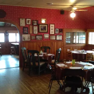 Dining area with memorabilia about the owners on the wall.