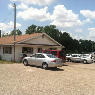 cars parked in front of the restaurant