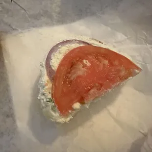 Generous half slice of tomato and one onion strip