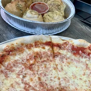 a pizza and a side of bread