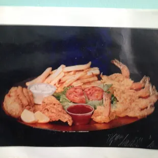 a plate of fried shrimp and fries