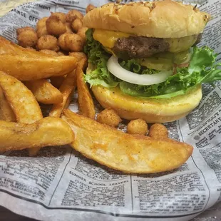 Single cheeseburger with potato wedges and mini hushpuppies