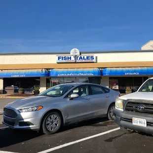 two cars parked in a parking lot
