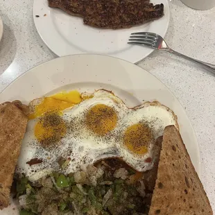 a plate of food with eggs and toast