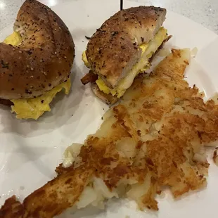 a bagel sandwich and hash browns