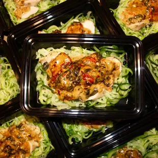 creamy tuscan chicken over zoodles