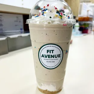 a cup of ice cream with sprinkles