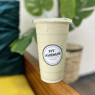 a coffee cup on a bench