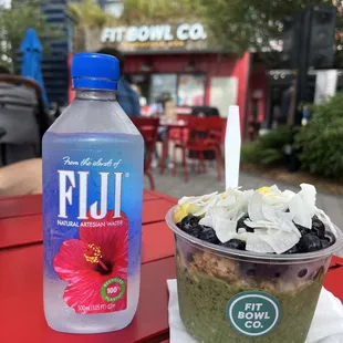 a drink and a bowl of food on a red table