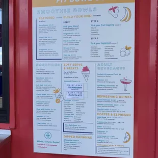 a menu on a red wall