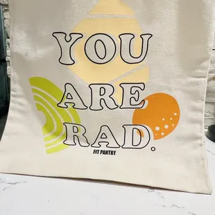 a tote bag that says you are rad
