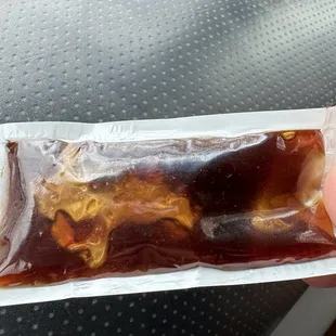 Honey packets that look way too old to use.