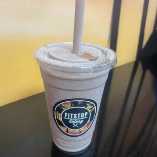 a smoothie in a plastic cup