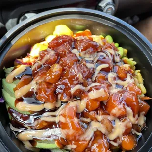 Island poke bowl with Loads of hot sauce