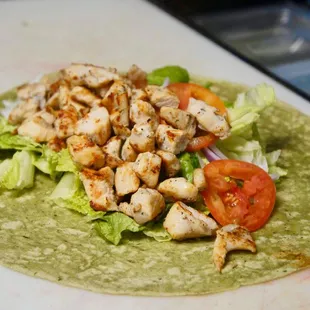 a chicken salad on a tortilla