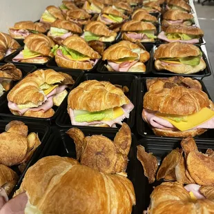 a table of croissant sandwiches