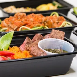 a variety of containers of food