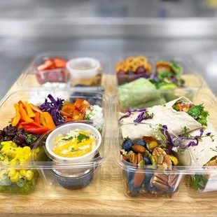 a variety of food in plastic containers