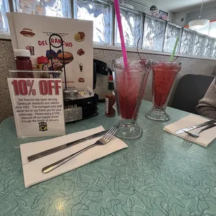 a table with drinks and menus
