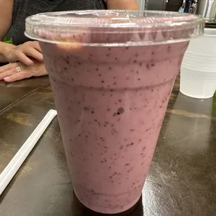 Honeybee smoothie with blueberries strawberry and banana in coconut milk with honey