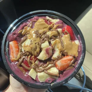 Smoothie bowl: Acai You Later smoothie blend, topped with strawberries, bananas, peanut butter, and nutella