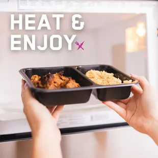 a woman holding two trays of food