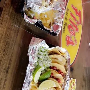 two tacoss on a table