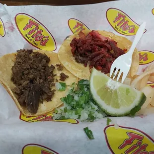 One bistek and one trompo taco.