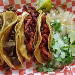 tacos de Bistec (steak) and tacos de trompo