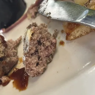 Raw burger, after it had been sent back once