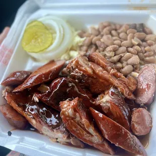 a plate of meat and beans