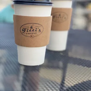 two coffee cups on a table