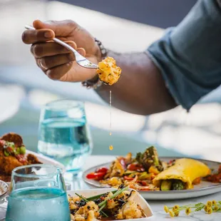 a plate of food and a glass of water