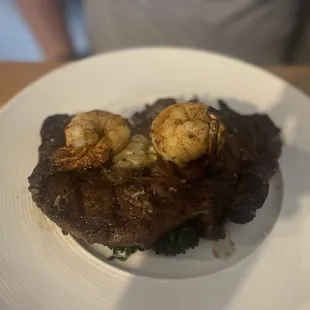 Ribeye steak with shrimp on top