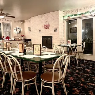 a dining room with a fireplace