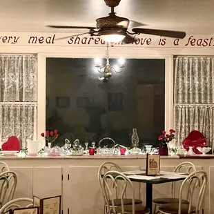 a dining room with a ceiling fan