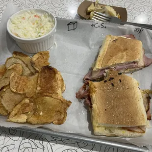 Cubano sandwich and side of coleslaw. Above my tray you can see the sample of the delicious baked potato casserole.