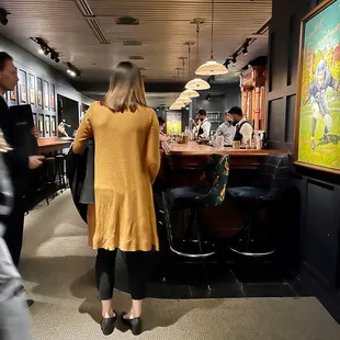 a man and a woman at a bar