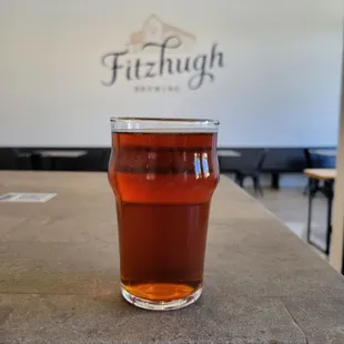 a glass of beer on a table