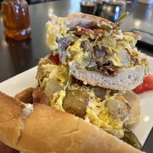 Bacon, eggs. Potato, and long hots on sarcone fresh baked Italian bread.