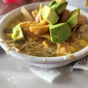 Cup of chicken tortilla soup with avocados on top :)