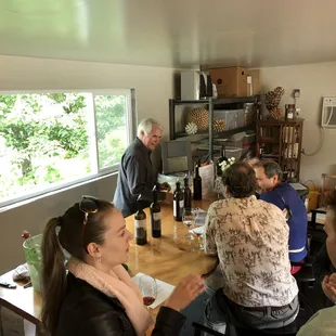 a group of people sitting around a table