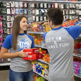 a man and a woman shopping in a store