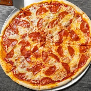 a pepperoni pizza on a platter