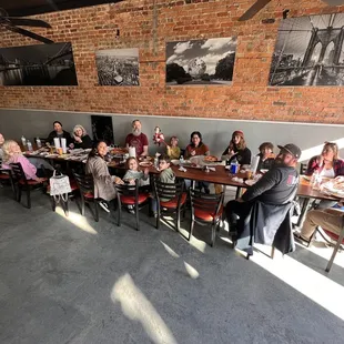a large group of people sitting around a table